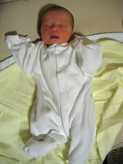 Jessica looks cute asleep in her baby grow