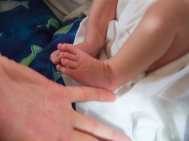 Jessica's feet next to Heidi's fingers