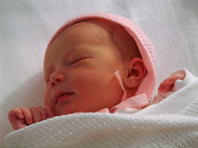 Jessica asleep in her cot