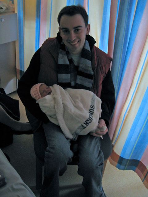 Rupert holding a sleeping Jessica